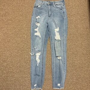 Women’s Distessed and ripped light wash jeans